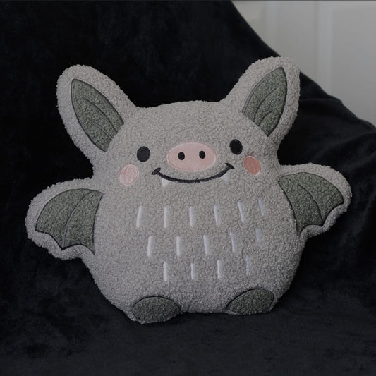 Niedliches Bouclé Kissen mit Fledermausmotiv